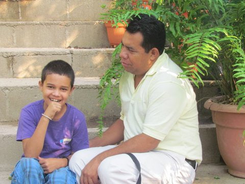 Pastor Carlos Baez of Kids of Cascabel with Little Fanuel