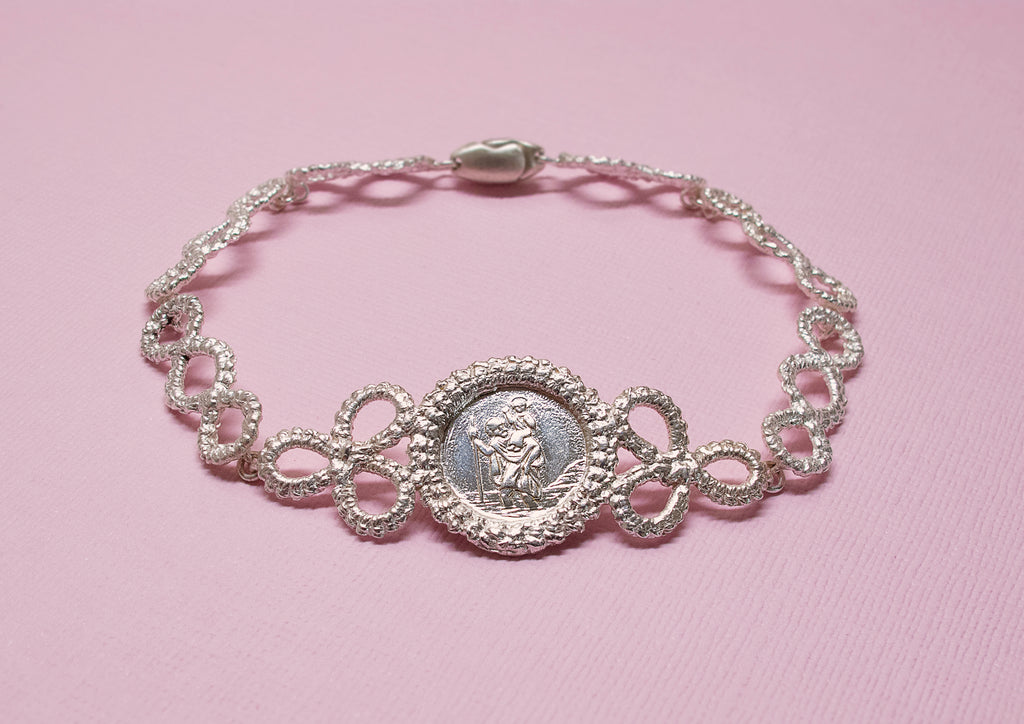 Silver lace bracelet featuring St Christopher charm