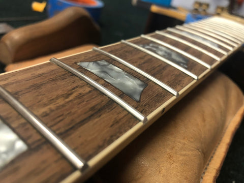 Leveled and polished frets