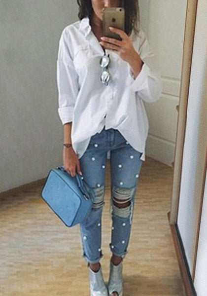 Model_wearing_faux_pearl_distressed_straight-leg_jeans_with_white_shirt