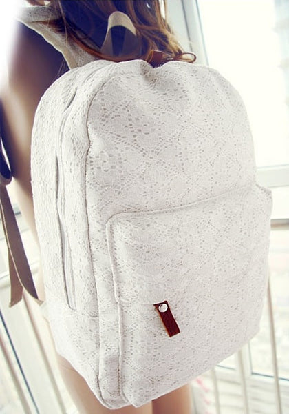 White lace backpack on a girls back