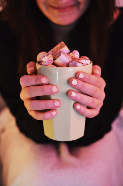 girl drinking hot chocolate with marshmallows