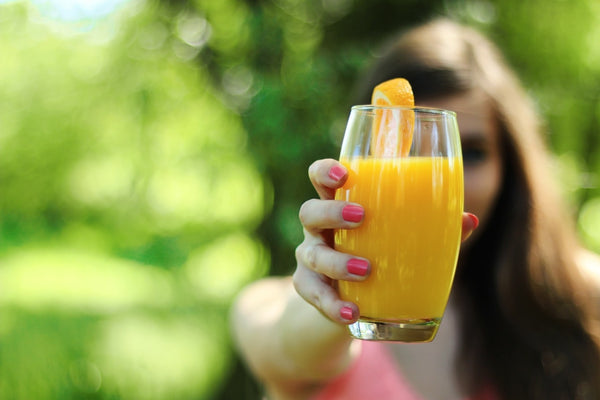 Girl with a glass of orange juice