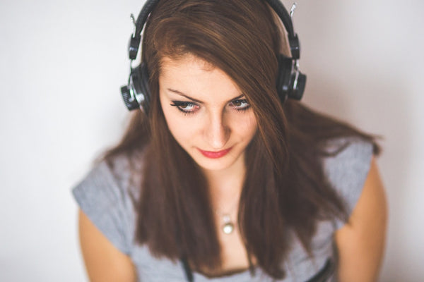 girl listening to music with her headset