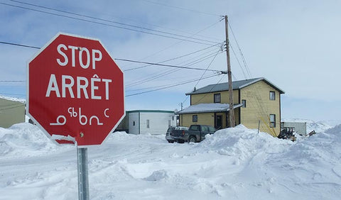 Trilingual stop sign in Iqualuit Baffin Island