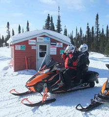 John and Karen snowmobiling near Labrador City