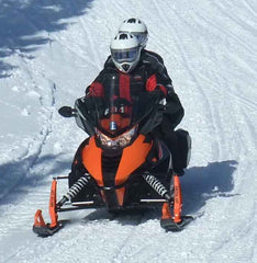 John and Karen snowmobiling near Labrador City