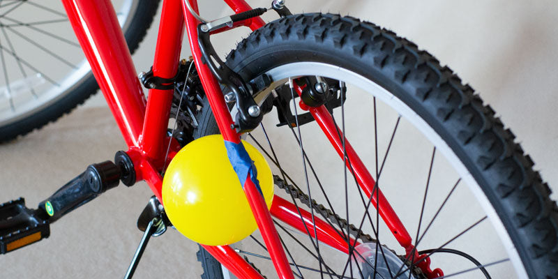 Partially inflated balloon in bike spokes