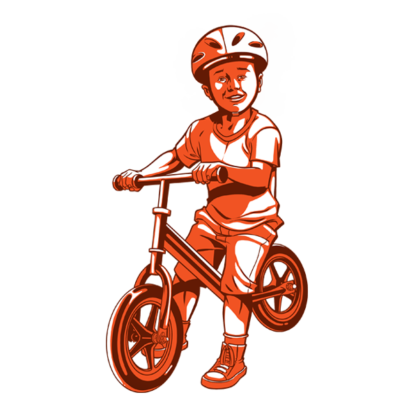 A young child riding on his balance bike
