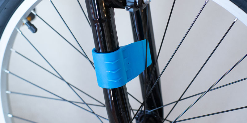 Spokester bicycle noise maker snapped onto front bike fork