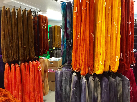 autumn-colored yarn drying in the studio