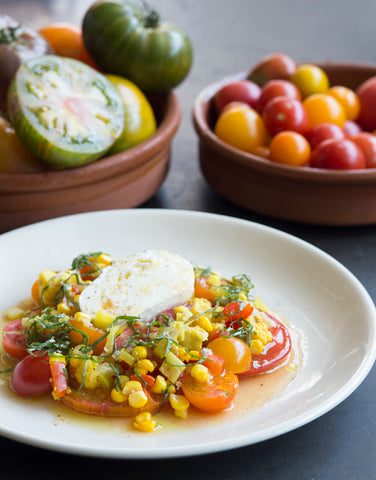 Olympia Provisions salad made with cherry tomatoes, cabbage, and chowchow