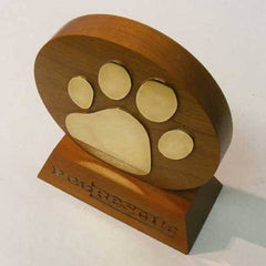 Rounded wood award with brass paw motif