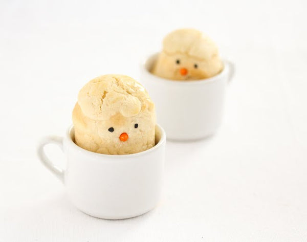 Chick Shaped Bread Rolls peering out of a coffee cup.