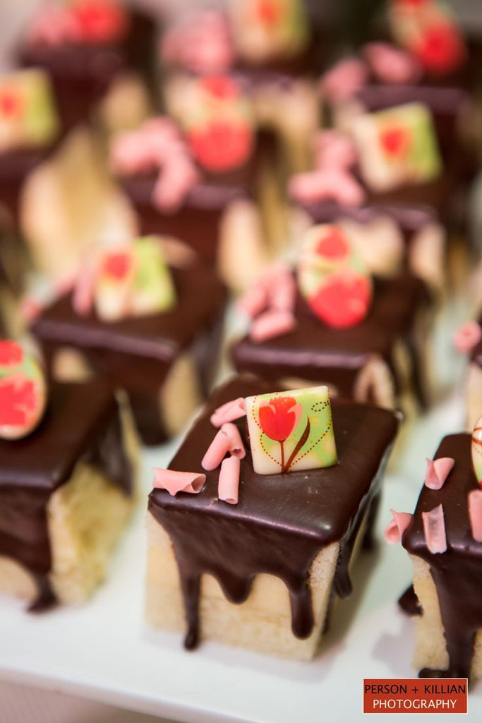 Miniature Boston cream pies covered in chocolate.