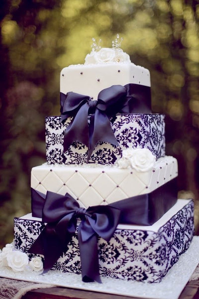 Purple and White Wedding Cake with Ribbons