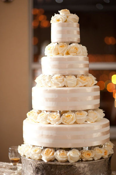 Elegant White and Shimmer Wedding Cake with Roses