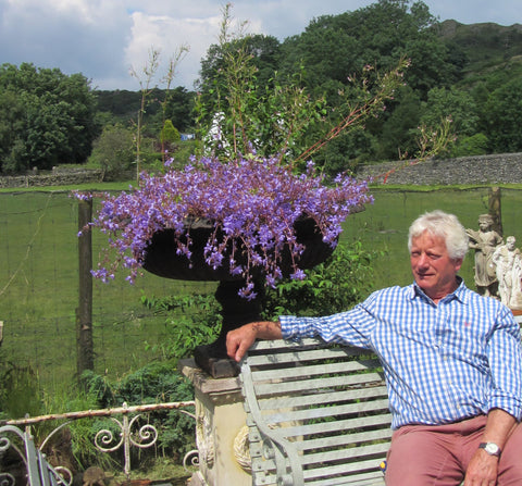 Clive Wilson at yew tree barn, reclaimed bench, cast iron urn lake district reclamation and salvage