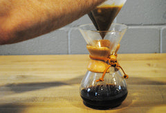 Someone taking the filter out of the Chemex