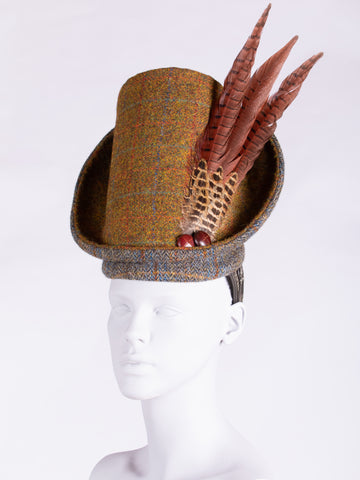 Rust and sage Harris Tweed hat with pheasant feathers and leather buttons