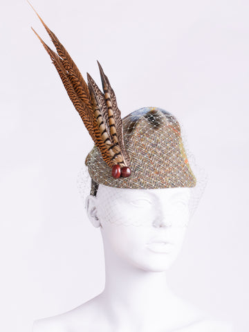 MacLeod and moss green tweed hat with long feather and veil