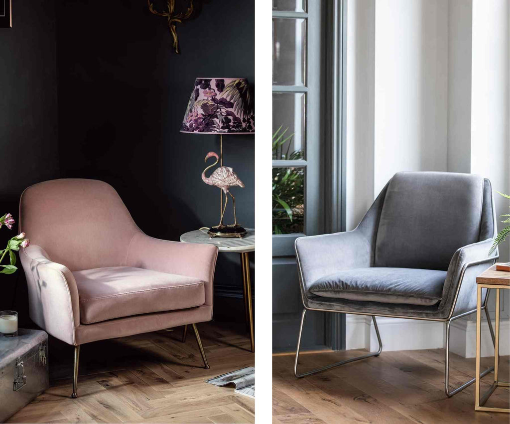 Pink velvet armchair with dark walls and grey velvet armchair next to big window