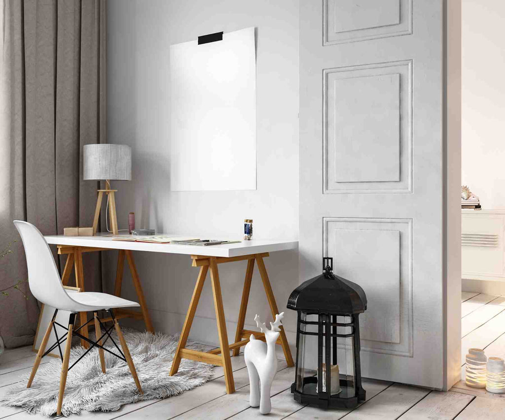 White desk chair with white desk facing a large doorway