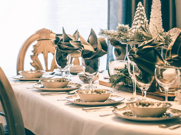 Scandi style Christmas tablescape with neutral colours and greenery