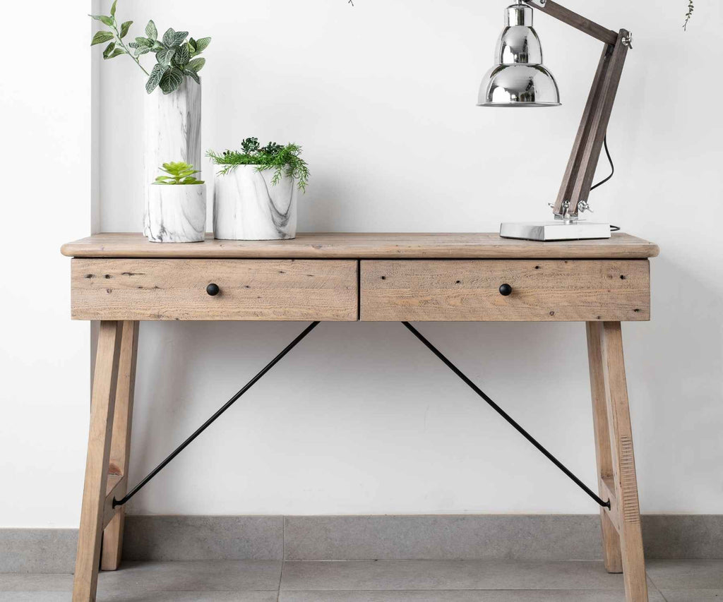 Reclaimed wood console table with lamp and plants