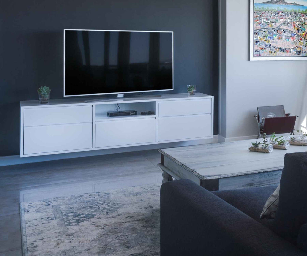 TV on white media unit with grey rug