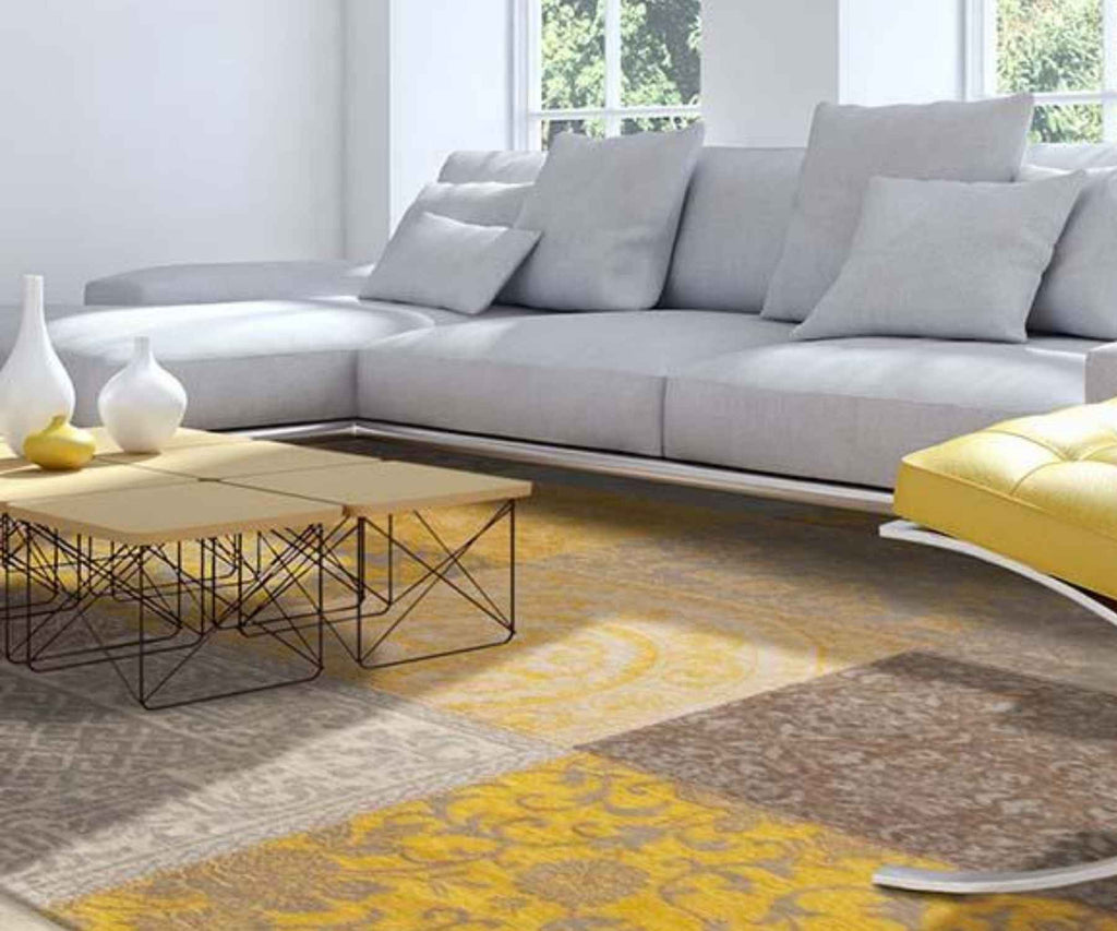 Large gold rug with cream large sofa and coffee table