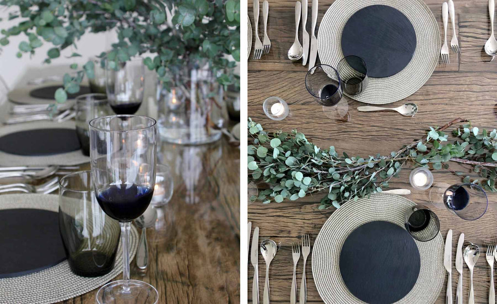 Silver and black round placemats and glasses