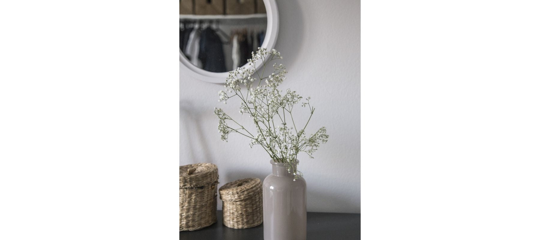 Grey vase with white flowers