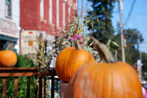 Pumpkins on a handrail. 