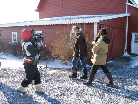Cameraman filming Josh and Brent on the farm. 