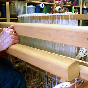 The front of a loom. 