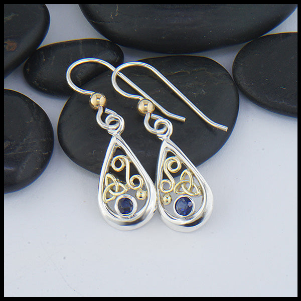 Custom Sterling Silver tear drop earrings with 18K Yellow Gold trinity knots and accents, set with a 3mm Sapphire. 