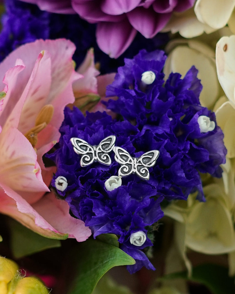 Butterfly post earrings in silver.