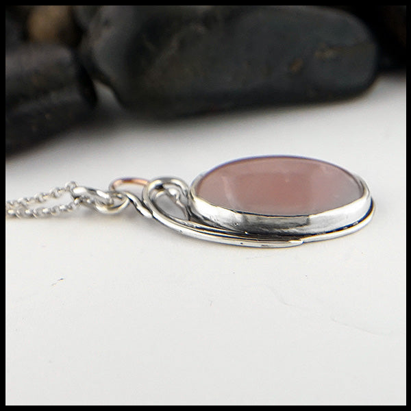 Profile view of custom Rose Quartz Floral pendant in Sterling Silver with 14K Rose Gold accent.