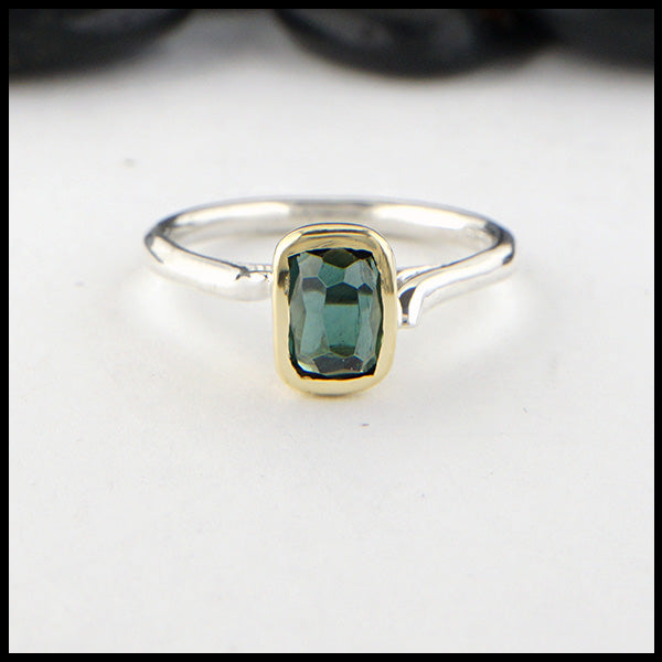 Rustic hand fabricated ring in sterling silver with an 18K yellow gold bezel set with a Rose Cut Blue Green Tourmaline.