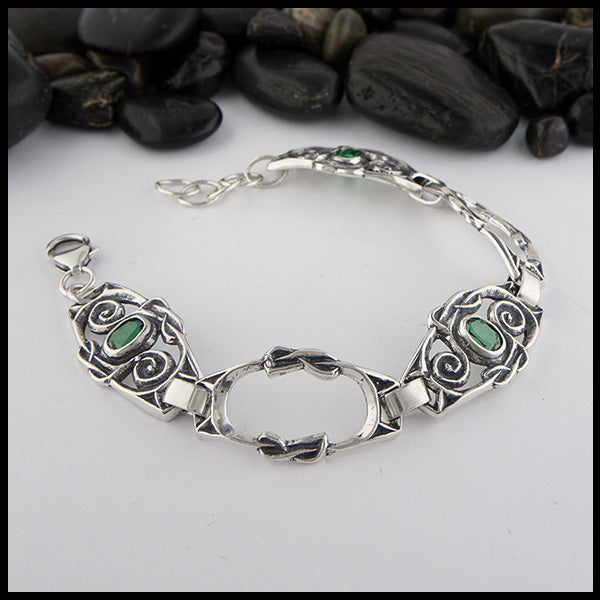 Celtic Spiral Link bracelet in Sterling Silver with Green Topaz. Made with three gemstone links & two open links.