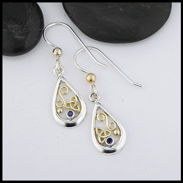 Custom Sterling Silver tear drop earrings with 18K Yellow Gold trinity knots and accents, set with a 2mm Sapphire. 