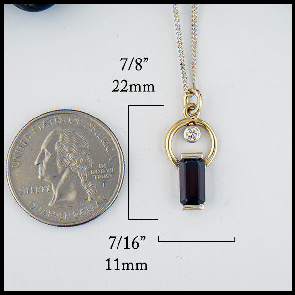 Garnet and Diamond Pendant in silver and gold measures 7/8" by 7/16"