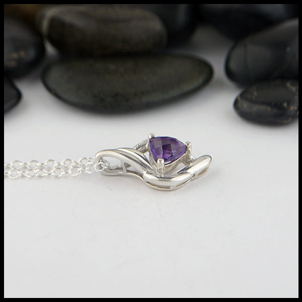 profile view of amethyst and silver pendant