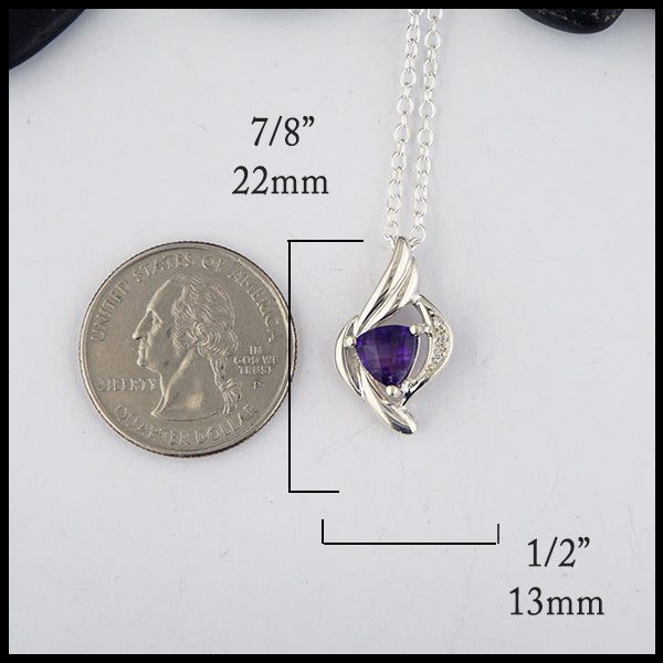 Dimensions of pendant 7/8 inch by 1/2 inch