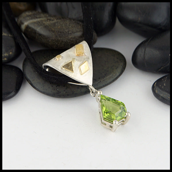 Peridot pendant in silver and gold