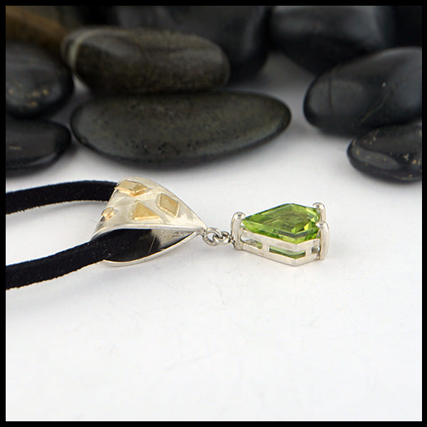 Peridot pendant in silver and gold