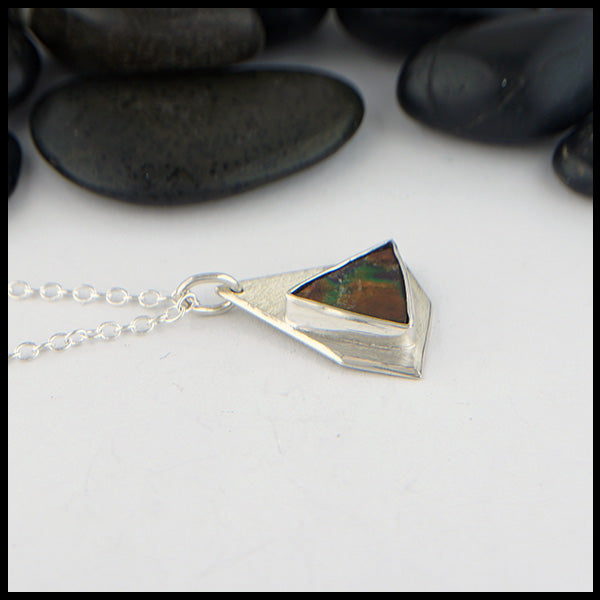 profile of ammolite pendant