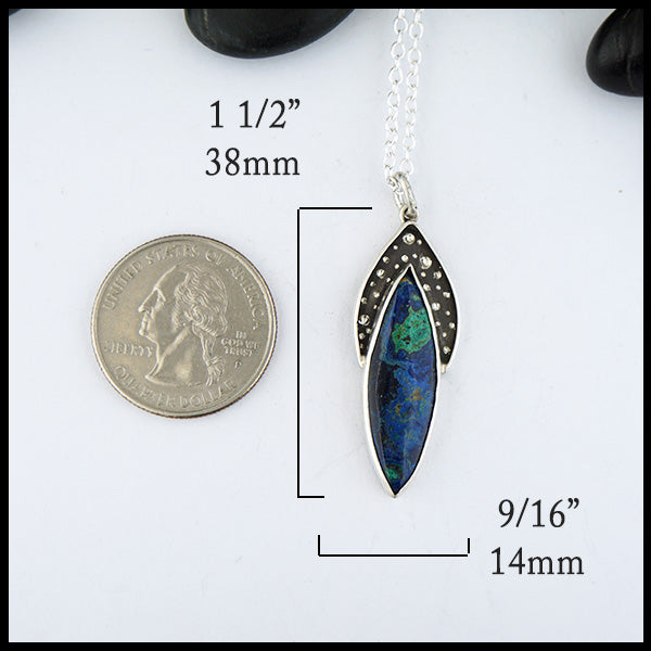 Pendant measures 1 1/2" by 9/16"