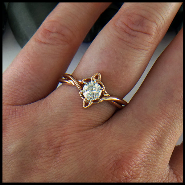 Interlocking Trinity Knot Wedding Set in 14K Rose gold with reclaimed diamond seen on model's hand